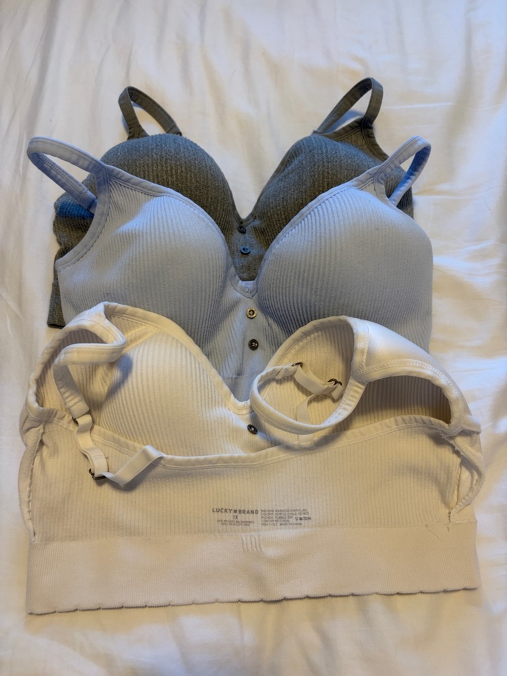 Lucky Brand Three-Pack Ribbed Seamless Bralettes in White, Light Blue, and Gray